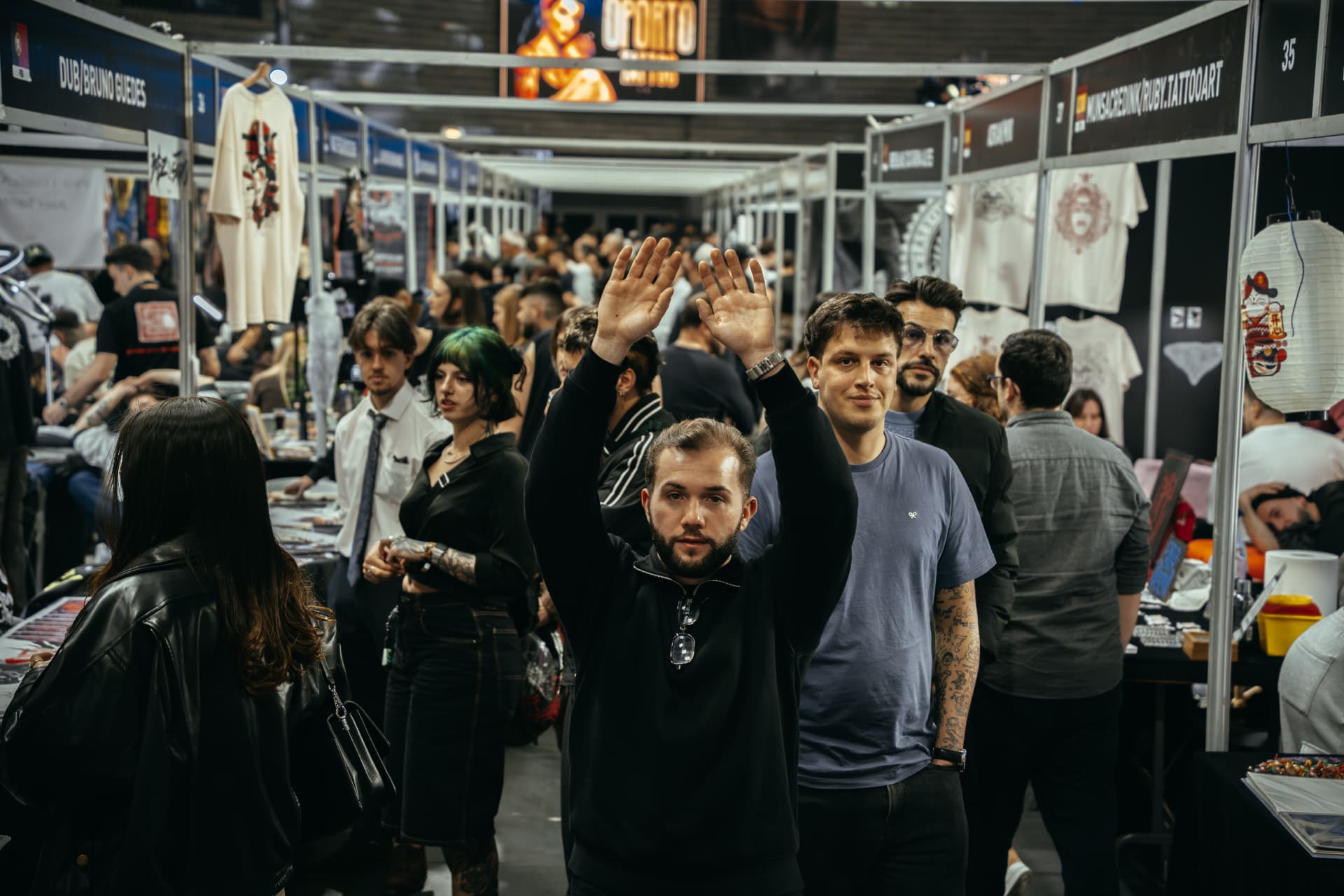 Visitors and artists in the main aisle