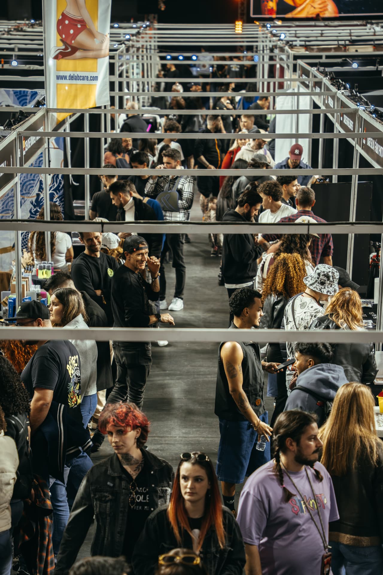 Visitors walking between the stand aisles